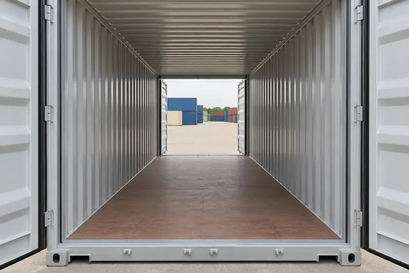 Ilustración interior centrada del contenedor tipo túnel, con las dos paredes largas cerradas, piso continuo y otro par de puertas abierto en el extremo opuesto